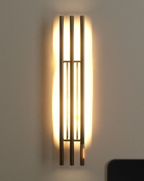 Lit view of brass wall light